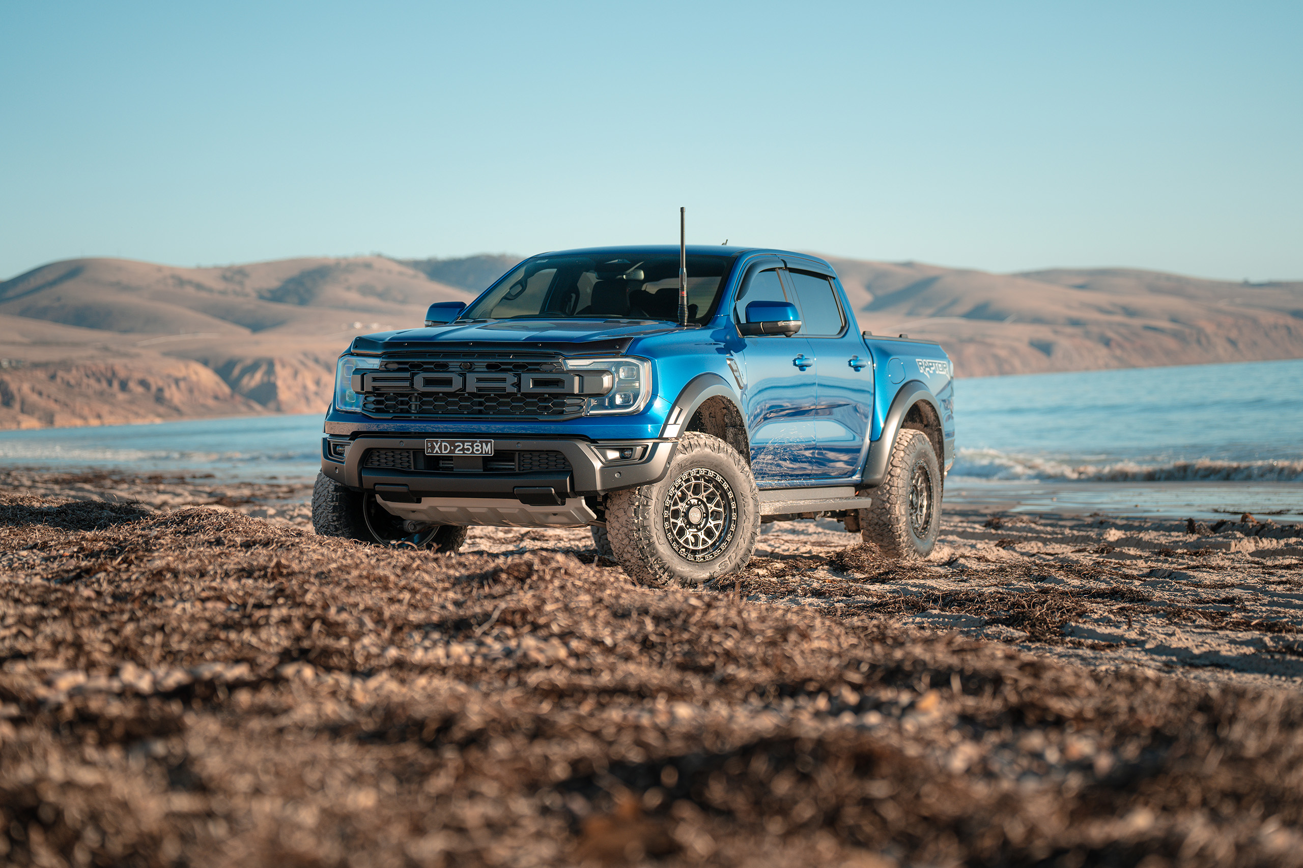 CSA-X Thunder graphite wheels on blue Next Gen Ranger Raptor at the beach CSA-X Thunder graphite wheels on blue Next Gen Ranger Raptor at the beach