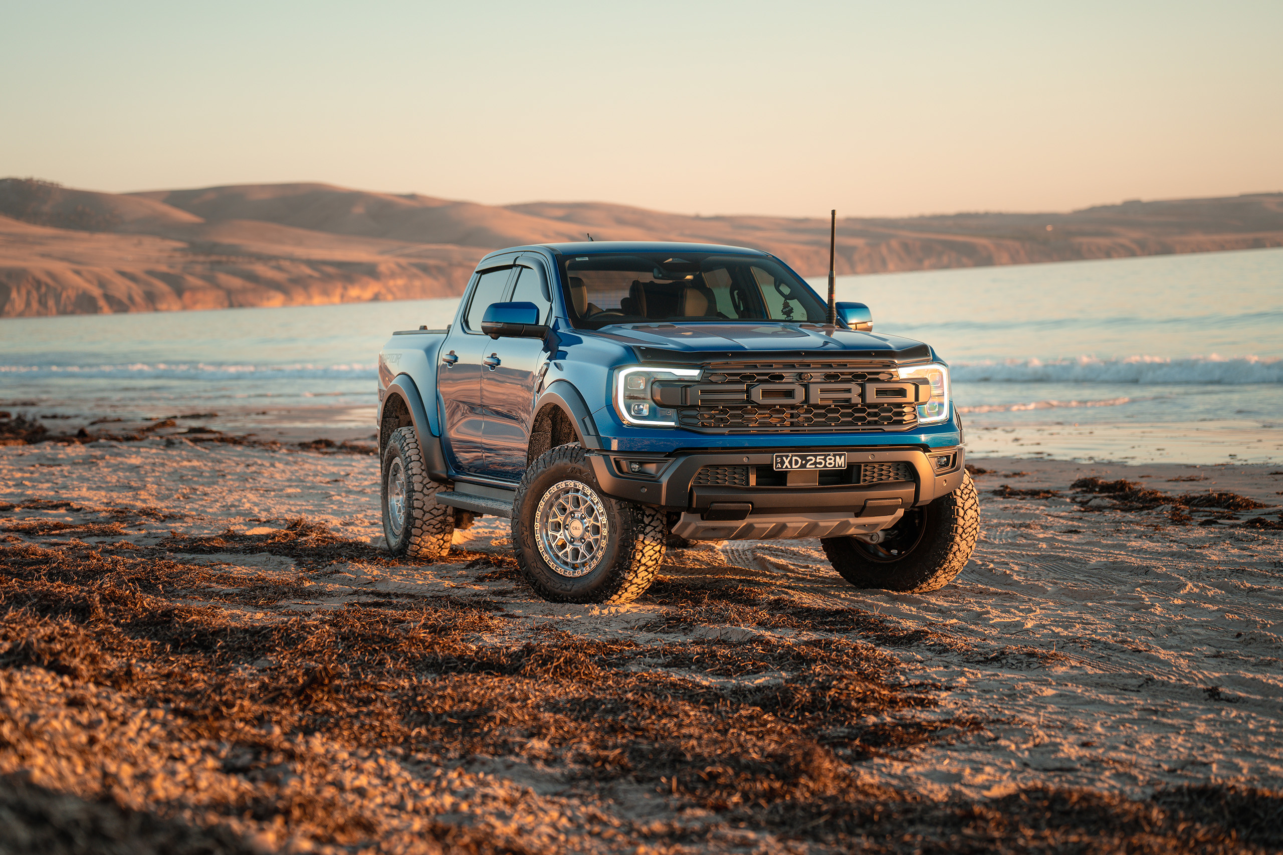 CSA-X Thunder machined wheels on Next Gen Ranger Raptor on the beach at sunset CSA-X Thunder machined wheels on Next Gen Ranger Raptor on the beach at sunset