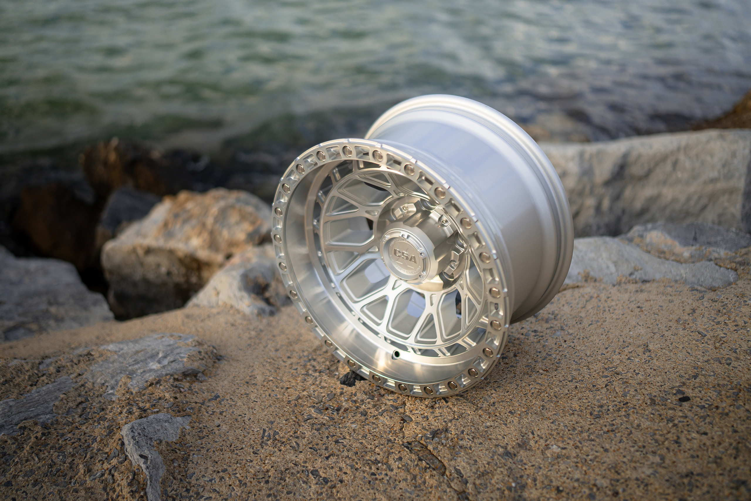 CSA Thunder Deep Dish Machined wheel on rocky outcrop near ocean