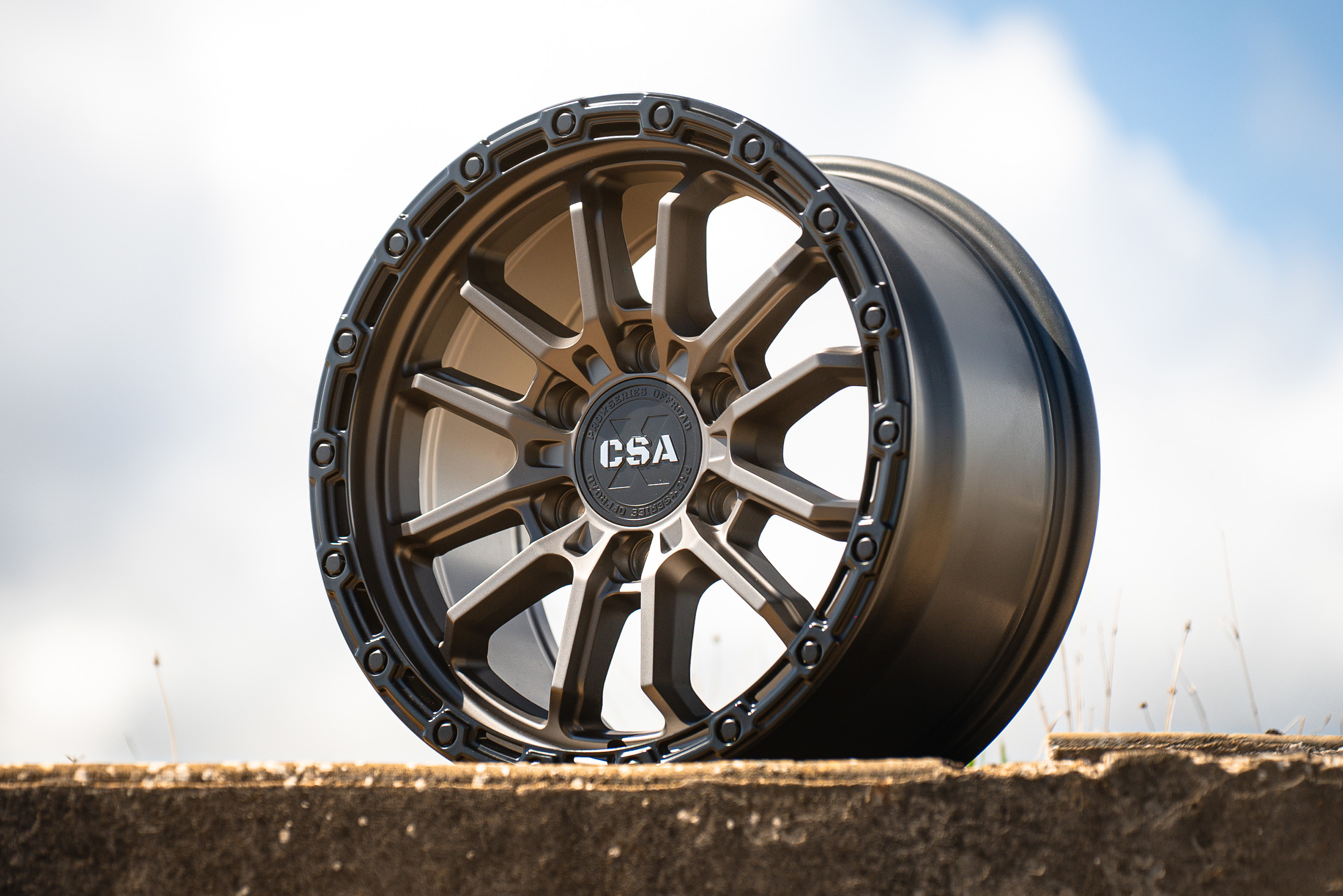 CSA Thor Satin graphite wheel close up view on concrete footing CSA Thor Satin graphite wheel close up view on concrete footing